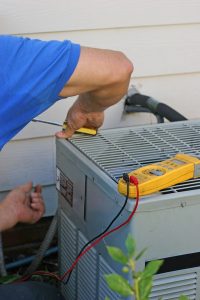 air-conditioner-being-worked-on